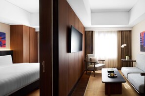 Suite | Living area | 40-inch LED TV with cable channels, TV, iPod dock