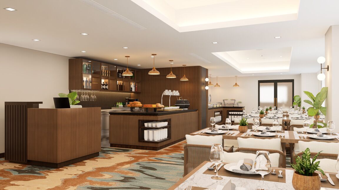 Un hall d’hôtel moderne comprenant un comptoir d’accueil, un bar et un espace de restauration avec des tables dressées pour les clients.