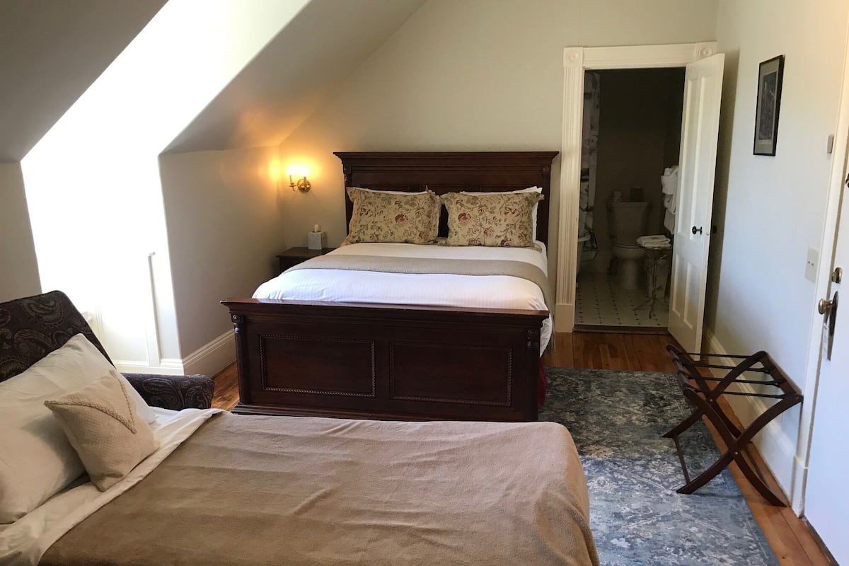 Premium bedding, down duvets, laptop workspace, blackout curtains