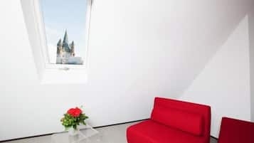 Junior Suite | Living area | 42-cm flat-screen TV with satellite channels, TV