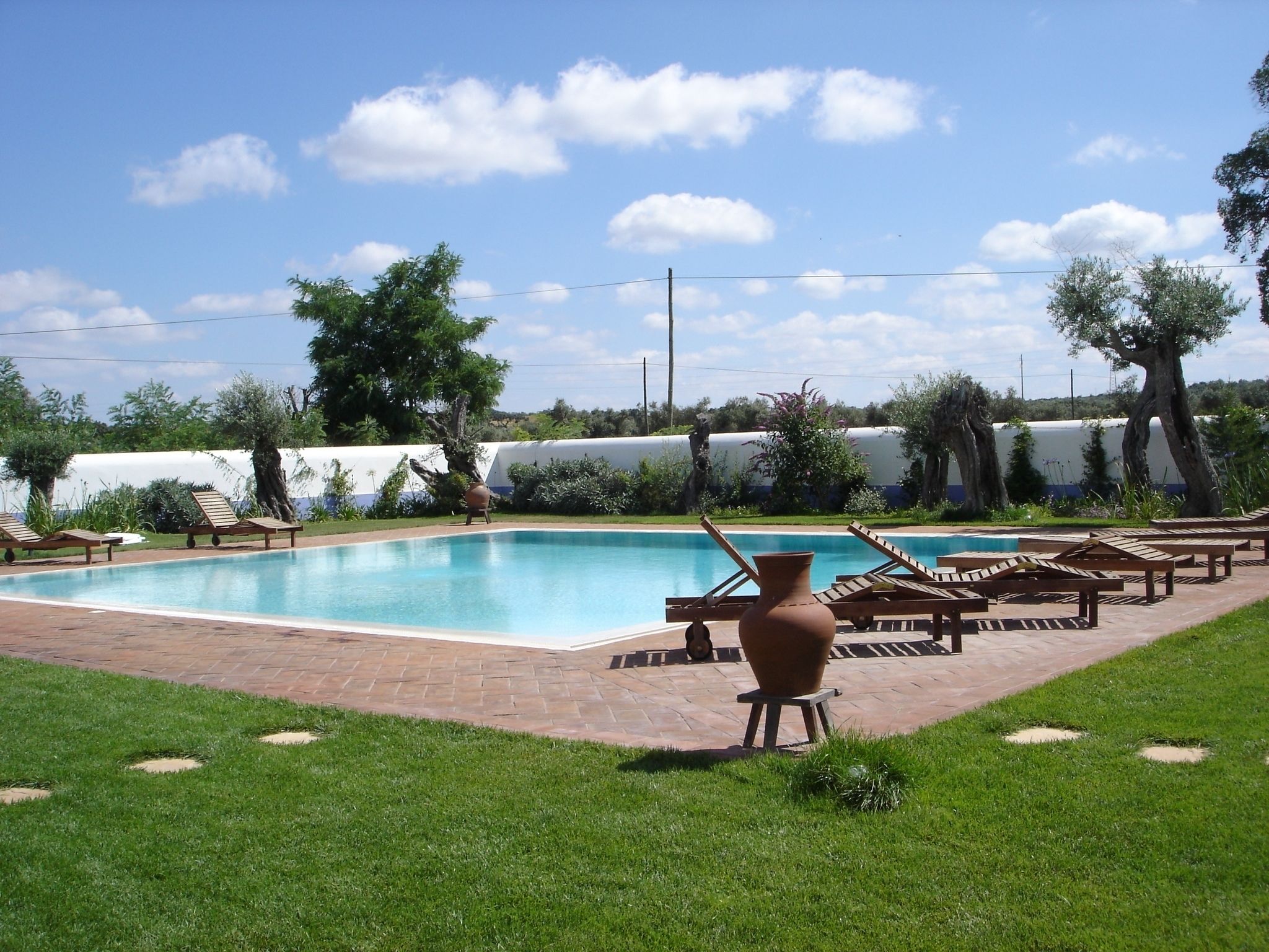 seasonal outdoor pool, pool umbrellas, pool loungers