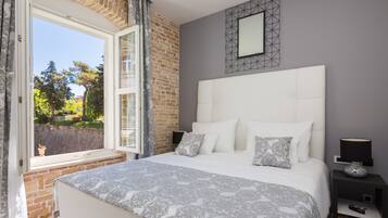 Luxury Suite, 1 Bedroom, Kitchen | Premium bedding, minibar, in-room safe, individually decorated