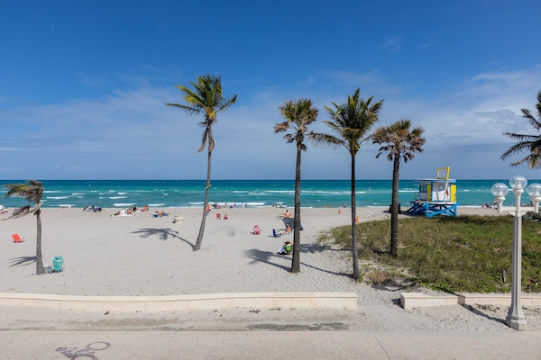 On the beach, sun loungers, beach umbrellas, beach towels