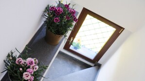 A staircase with potted plants at the top. - La Circumetnea B&B (Catania)