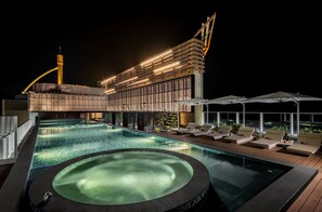 Outdoor pool, open 7:00 AM to 7:00 PM, pool umbrellas, pool loungers