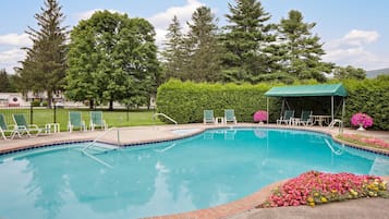 Indoor pool, seasonal outdoor pool, open 9 AM to 9 PM, pool umbrellas