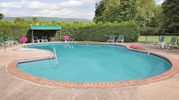 Indoor pool, seasonal outdoor pool, open 9 AM to 9 PM, pool umbrellas