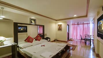 Honeymoon Suite | Living room | 32-inch LCD TV with satellite channels, TV, DVD player
