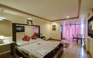 Honeymoon Suite | Living room | 32-inch LCD TV with satellite channels, TV, DVD player - Sunvalley Homestay (Coonoor)