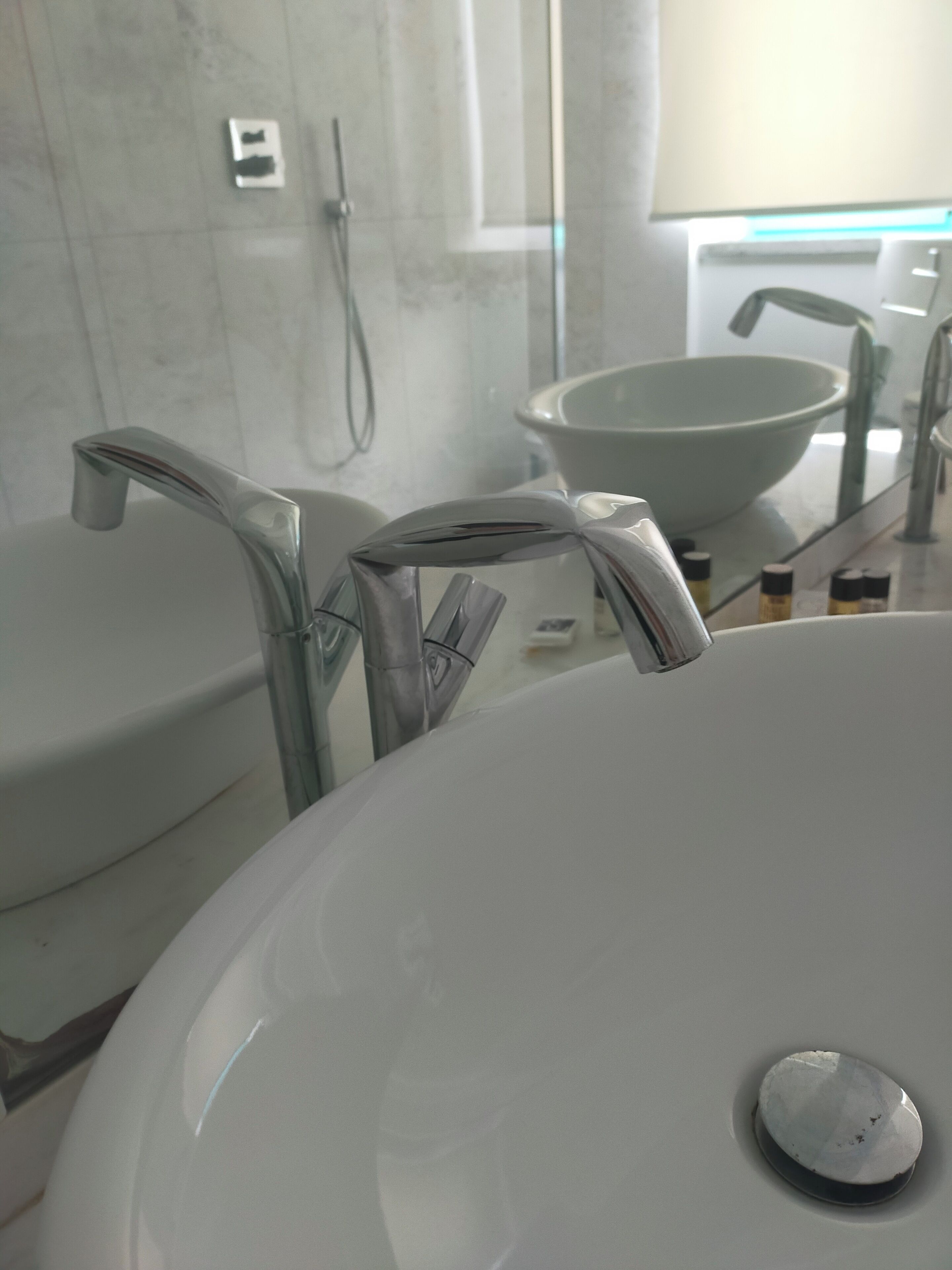 deluxe suite | bathroom | shower, rainfall showerhead, free toiletries, hair dryer