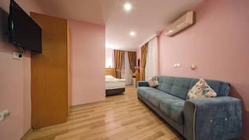 Family Room, Balcony | Minibar, in-room safe, iron/ironing board, free WiFi