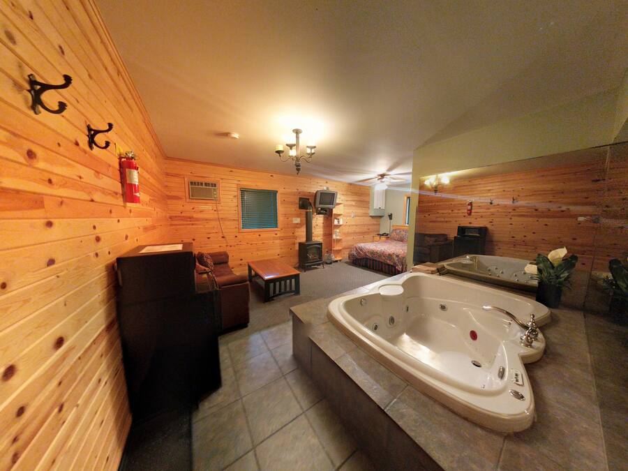 Deluxe Suite, 1 Queen Bed, Jetted Tub | Down duvets, individually decorated, individually furnished