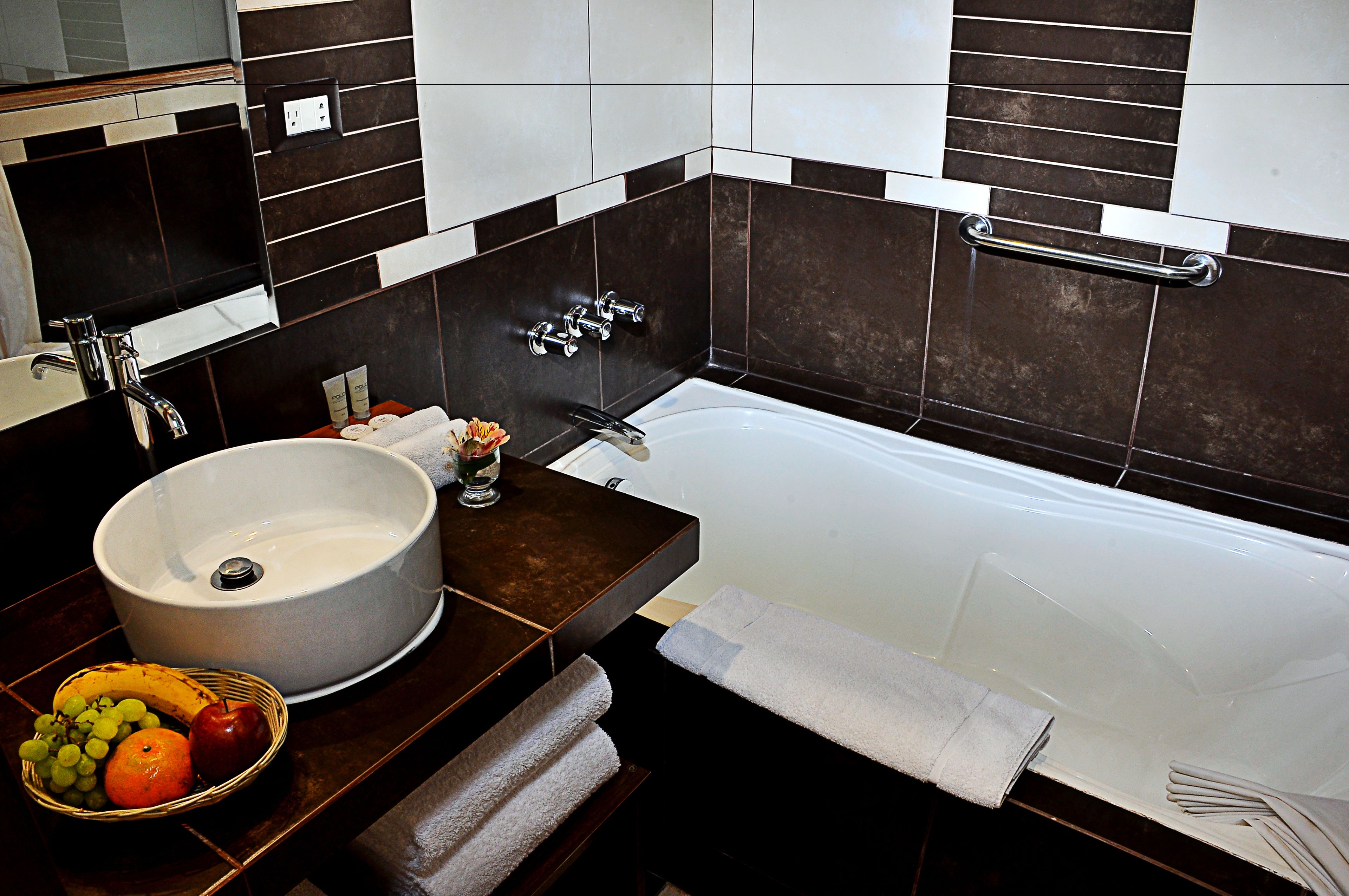 combined shower/bathtub, rainfall showerhead, designer toiletries