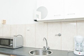 Fridge, microwave, stovetop, coffee/tea maker