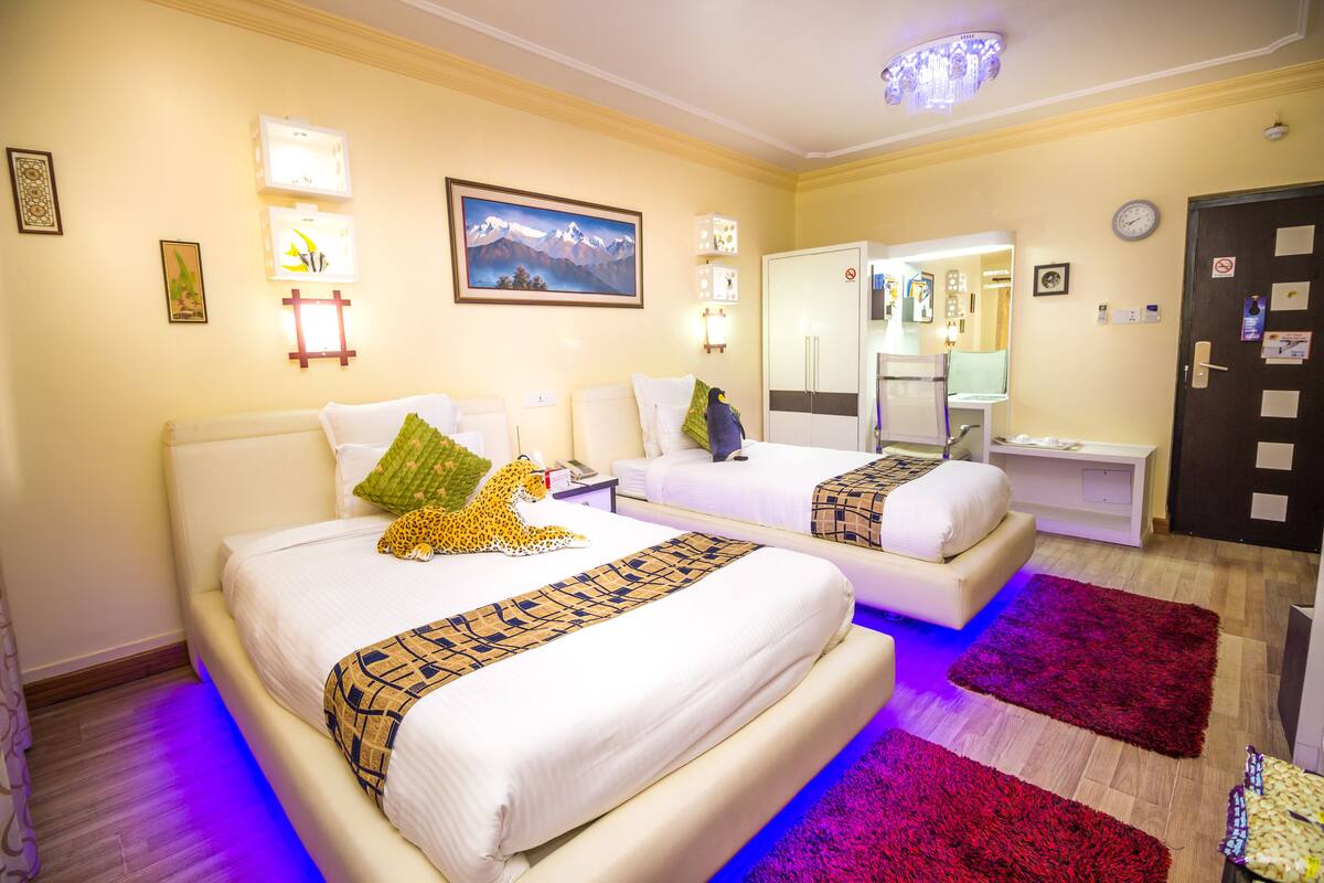 Deluxe Twin Room, 2 Bedrooms | Minibar, in-room safe, individually decorated, individually furnished