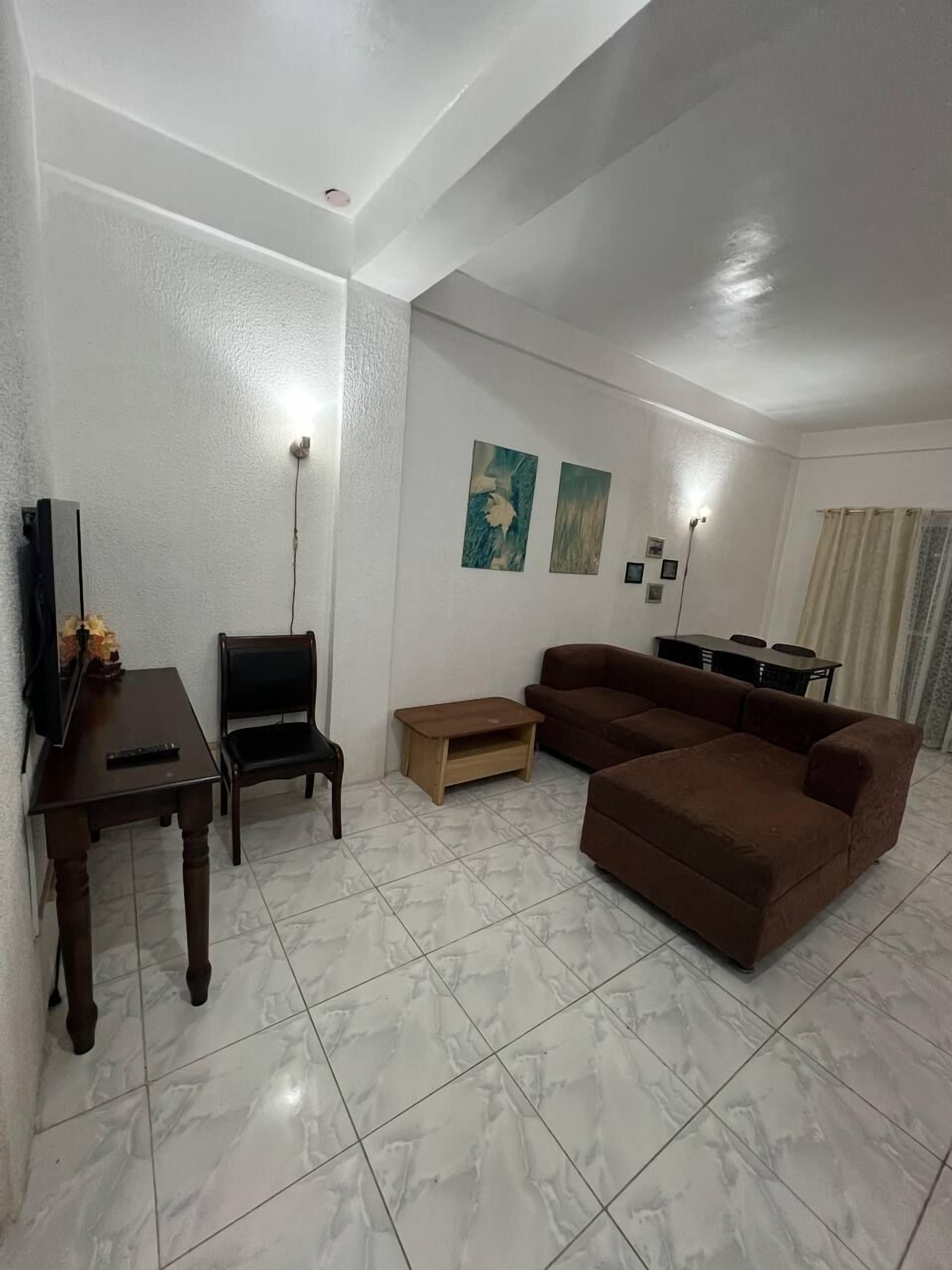 Suite, 2 Bedrooms | Living area | 42-inch flat-screen TV with cable channels, TV, DVD player