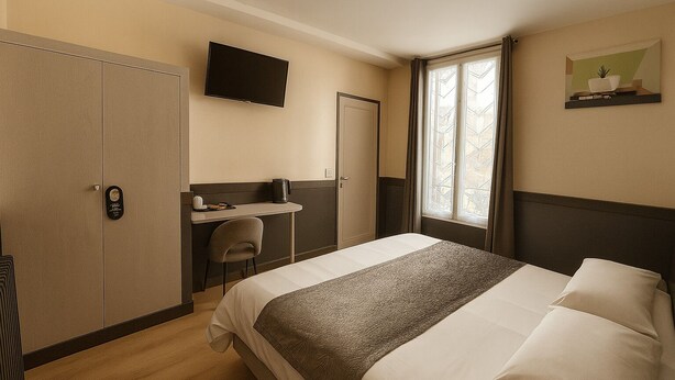 A hotel room with a bed, a desk, a chair, a TV, and a window. - Hôtel des Bains (Maisons-Alfort)