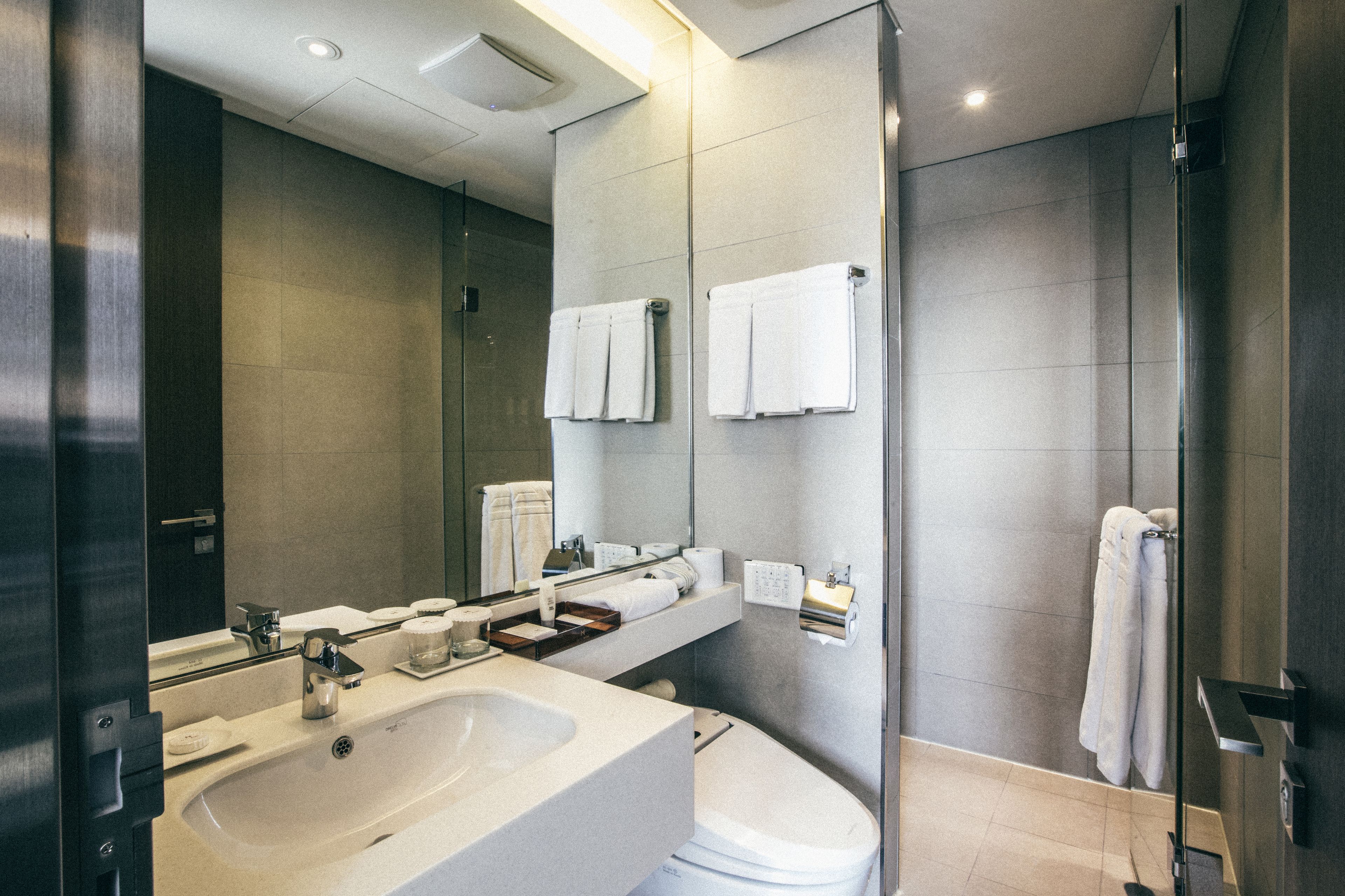 shower, hair dryer, bathrobes, slippers