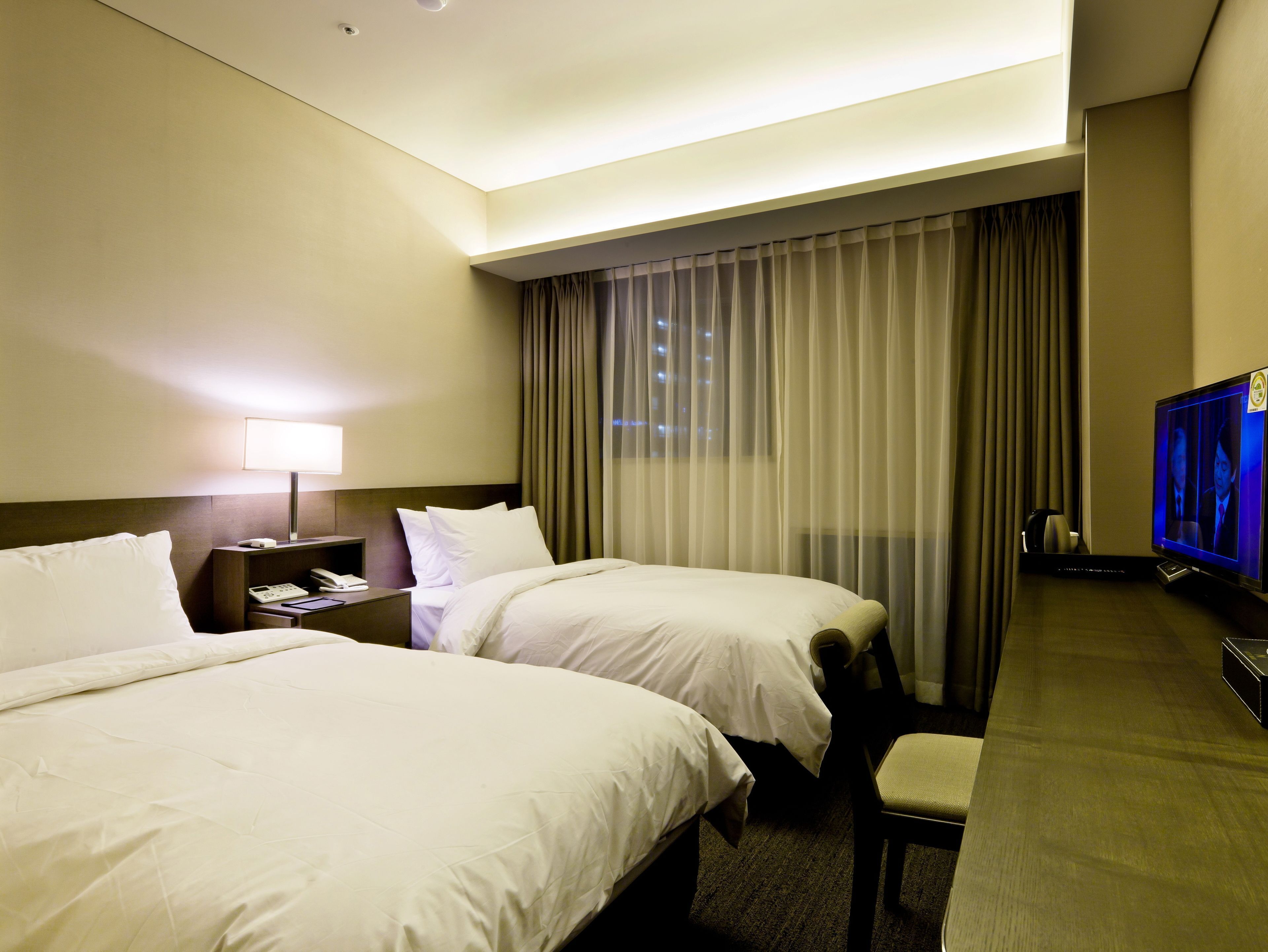Premium bedding, down duvets, in-room safe, desk