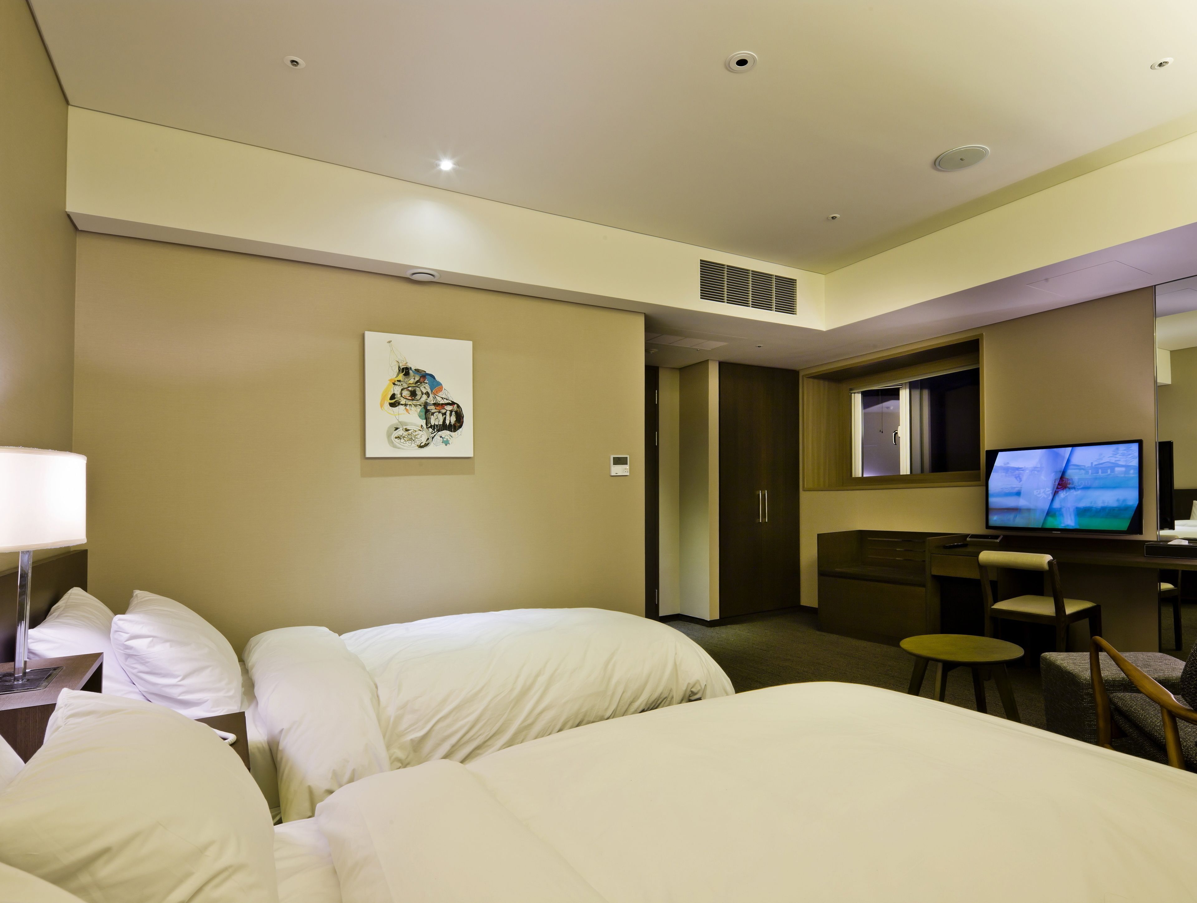 Premium bedding, down duvets, in-room safe, desk