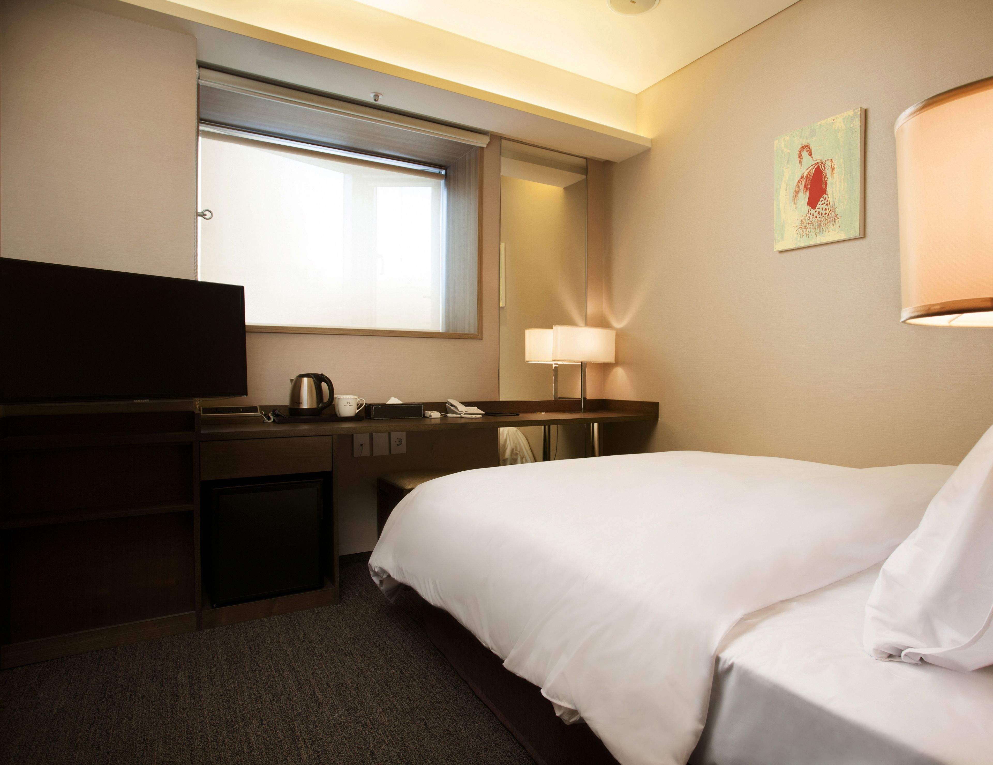 Premium bedding, down duvets, in-room safe, desk