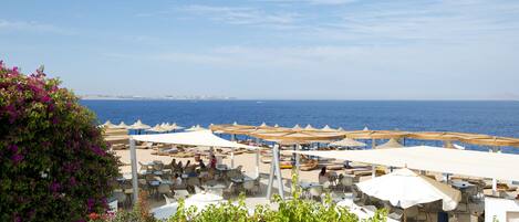 Private beach, white sand, sun-loungers, beach umbrellas