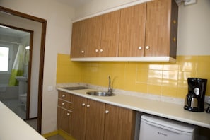 Fridge, stovetop, coffee/tea maker, cookware/dishes/utensils