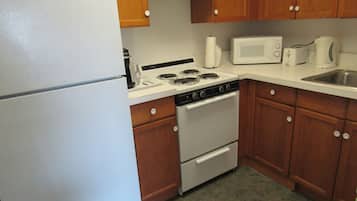 Family Suite, Multiple Beds | Private kitchen