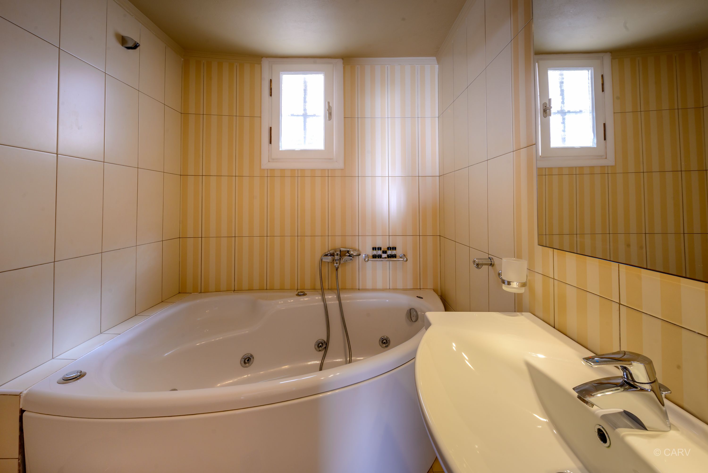 superior triple room, pool view | bathroom | bathtub, jetted bath, free toiletries, hair dryer