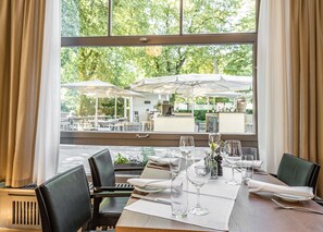 Breakfast, lunch, dinner served; international cuisine, garden views 