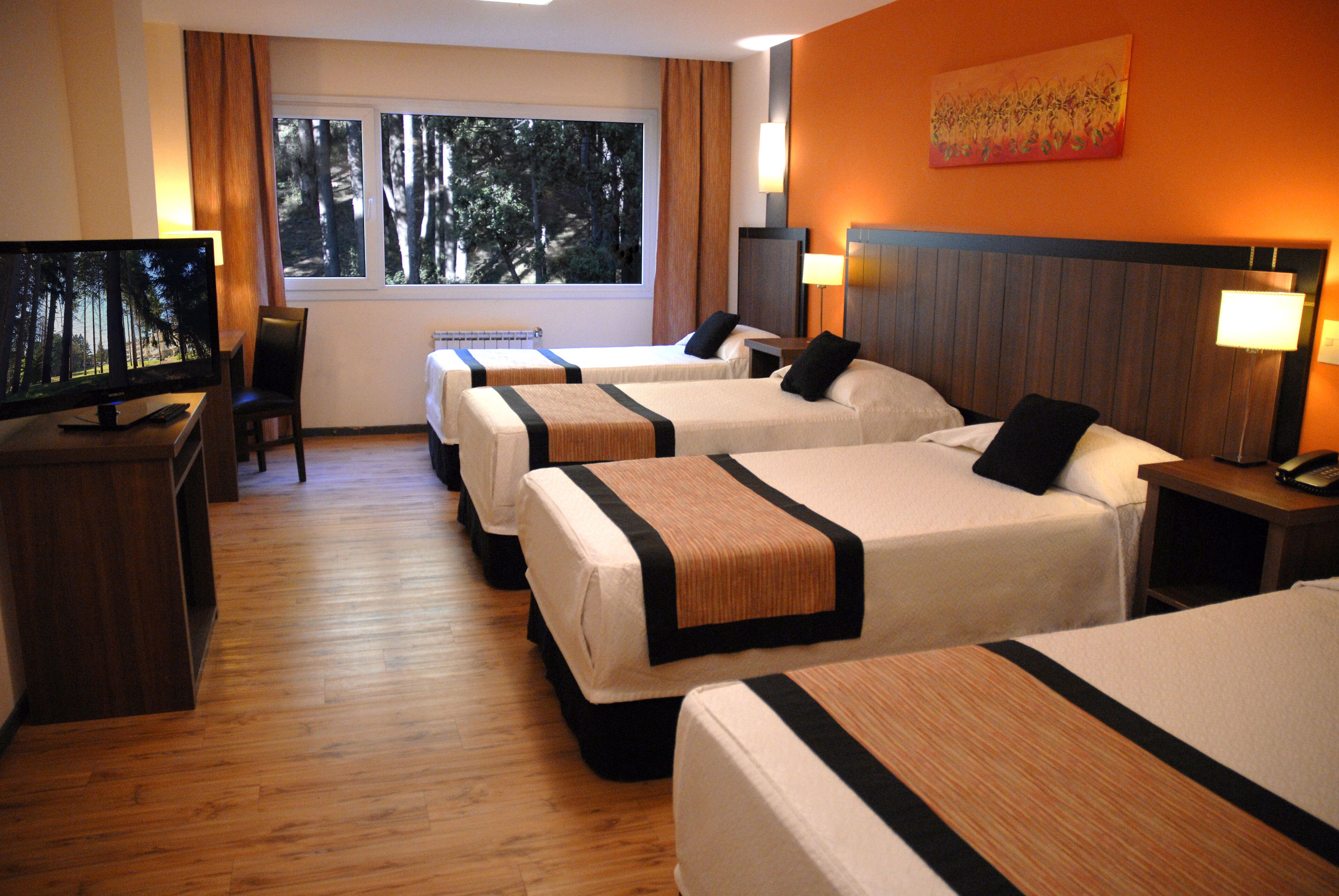 superior quadruple room, garden view | in-room safe, desk, blackout curtains, free wifi