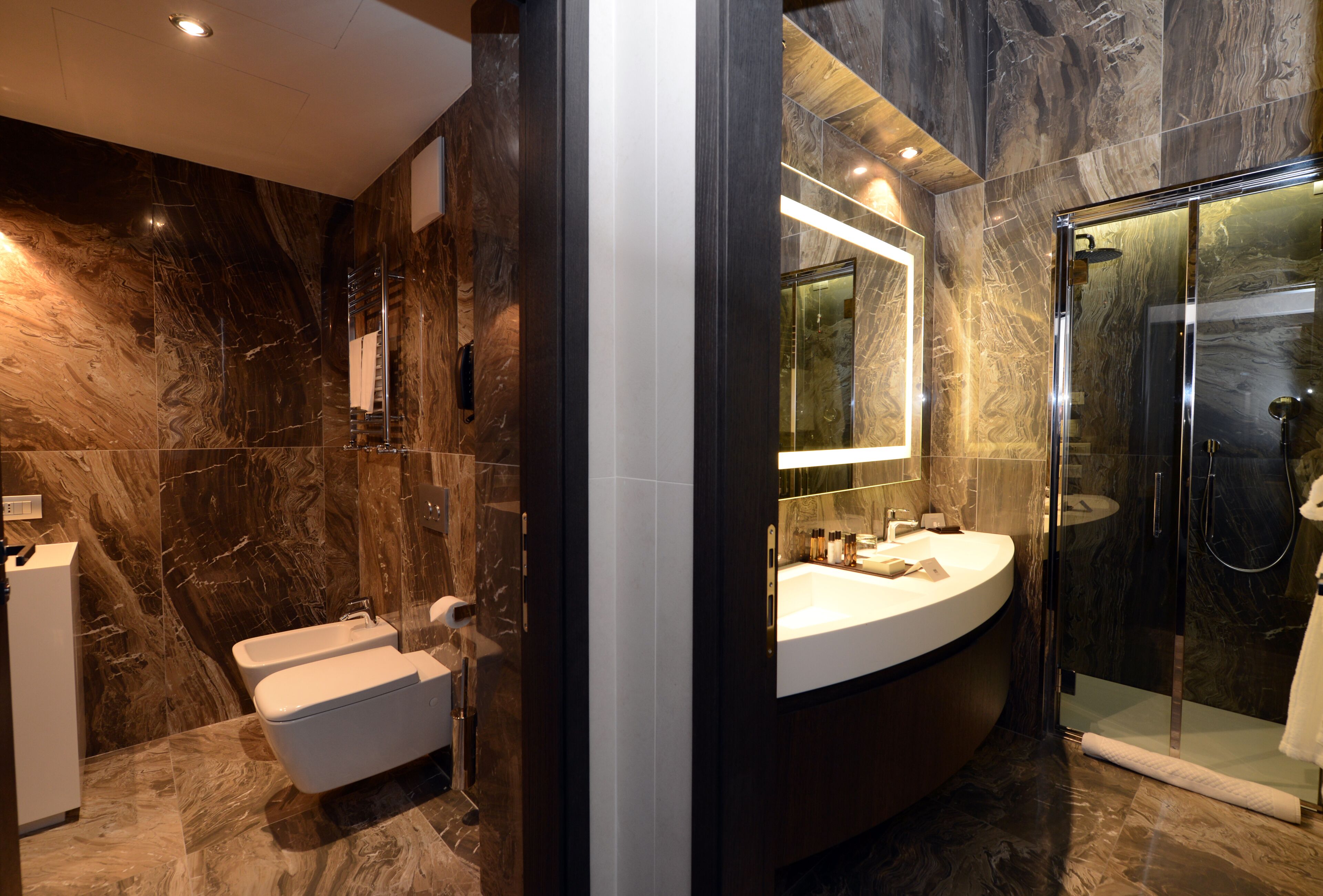 suite (riva, canal view) | bathroom | rainfall showerhead, free toiletries, hair dryer, slippers