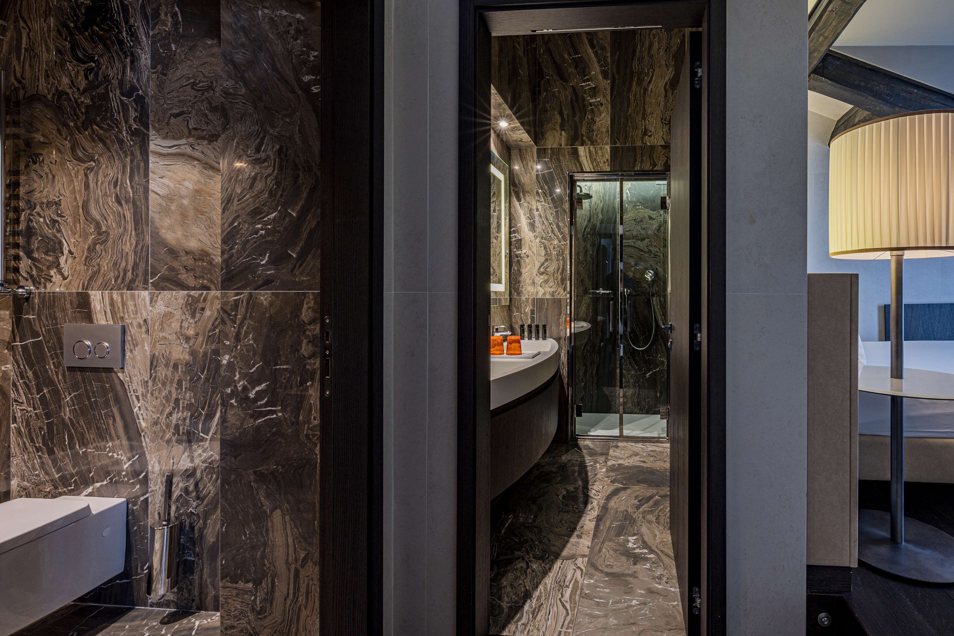 suite (riva, canal view) | bathroom | rainfall showerhead, free toiletries, hair dryer, slippers