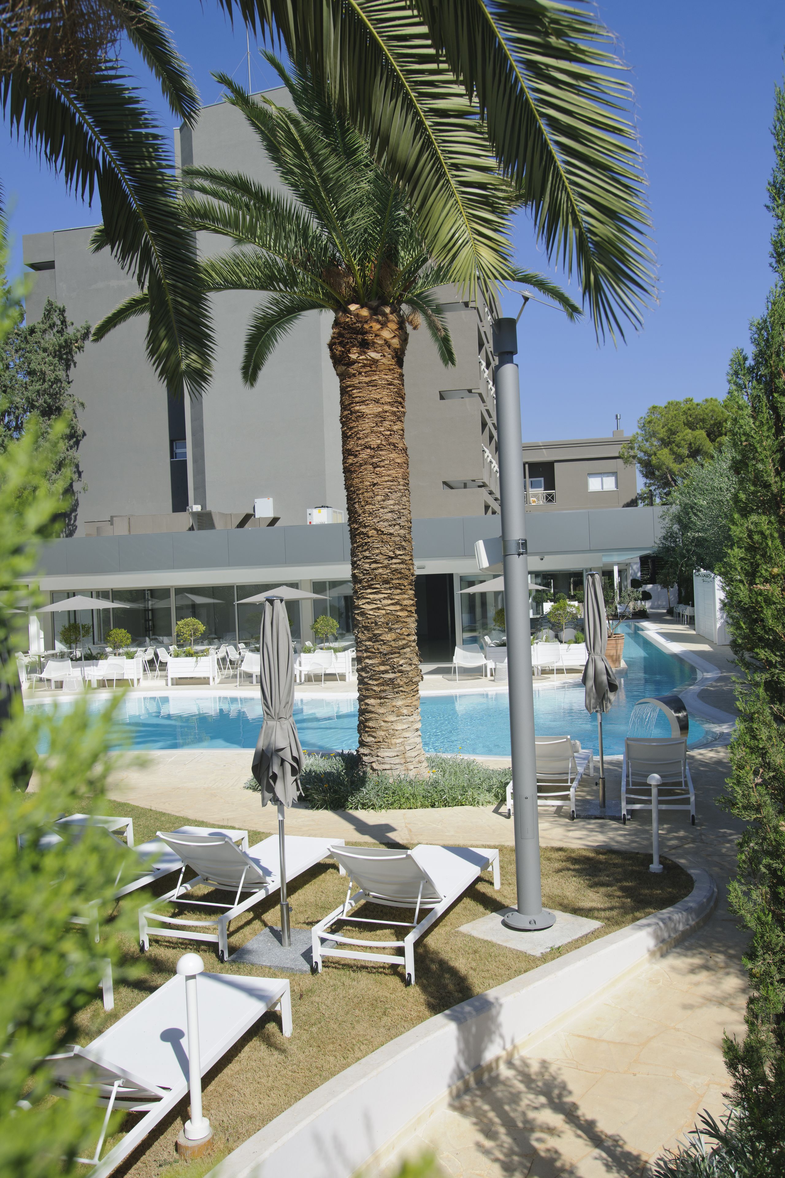 indoor pool, outdoor pool, pool umbrellas, pool loungers