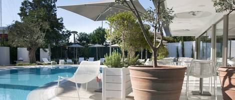 Indoor pool, outdoor pool, pool umbrellas, pool loungers