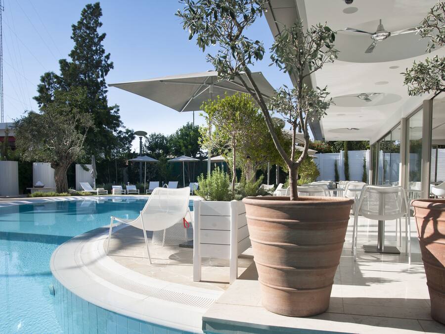 Indoor pool, outdoor pool, pool umbrellas, pool loungers