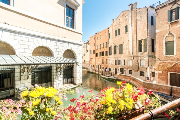 A canal in a historic European city with buildings on either side. - Ca Maria Callas (Venice)