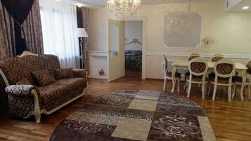 Deluxe Apartment, 1 King Bed | Living room | LCD TV