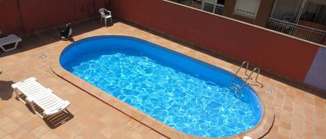 Seasonal outdoor pool, pool umbrellas, sun loungers