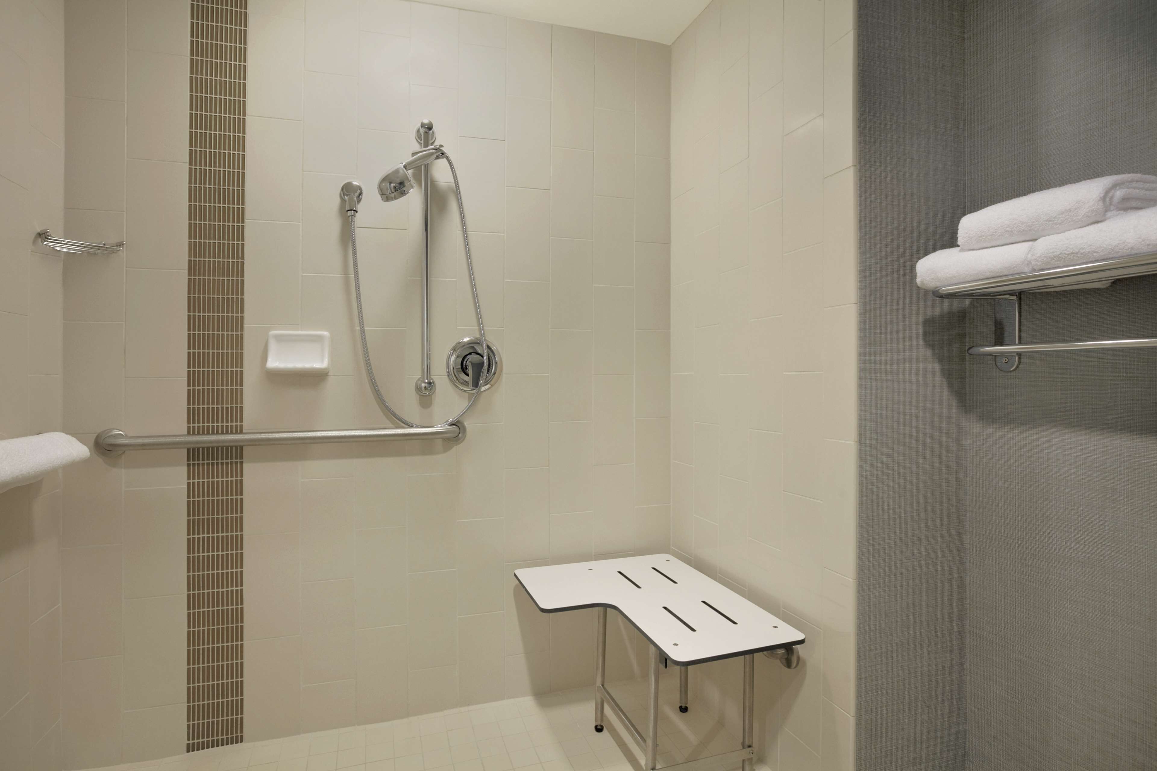 designer toiletries, hair dryer, towels