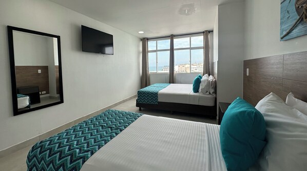 Standard Triple Room | 1 bedroom, in-room safe, bed sheets