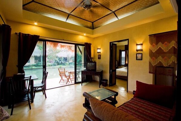 Superior Lagoon Villa | Living room | 21-inch TV with cable channels