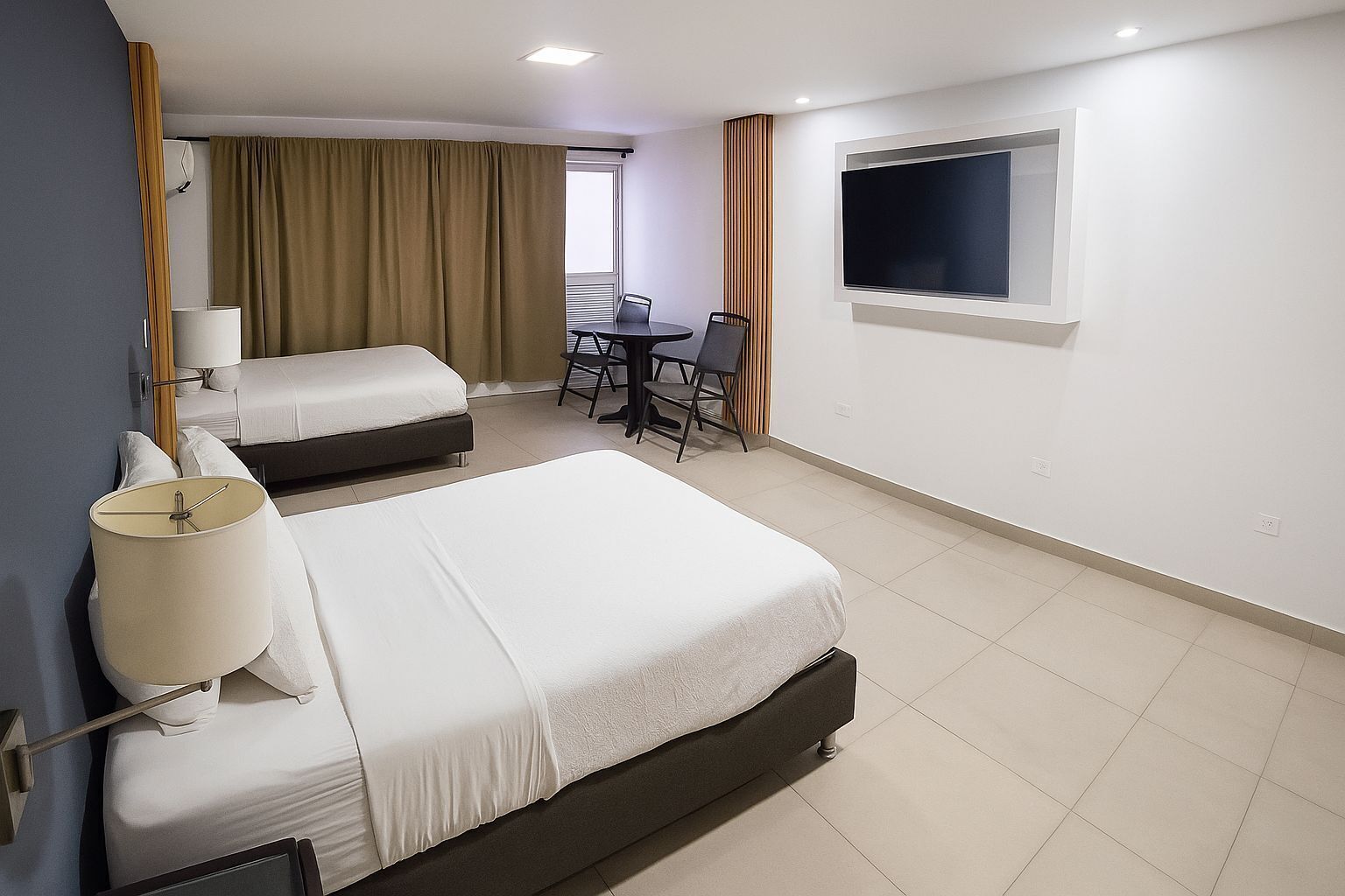 Triple Room, Courtyard View | Minibar, in-room safe, desk, soundproofing