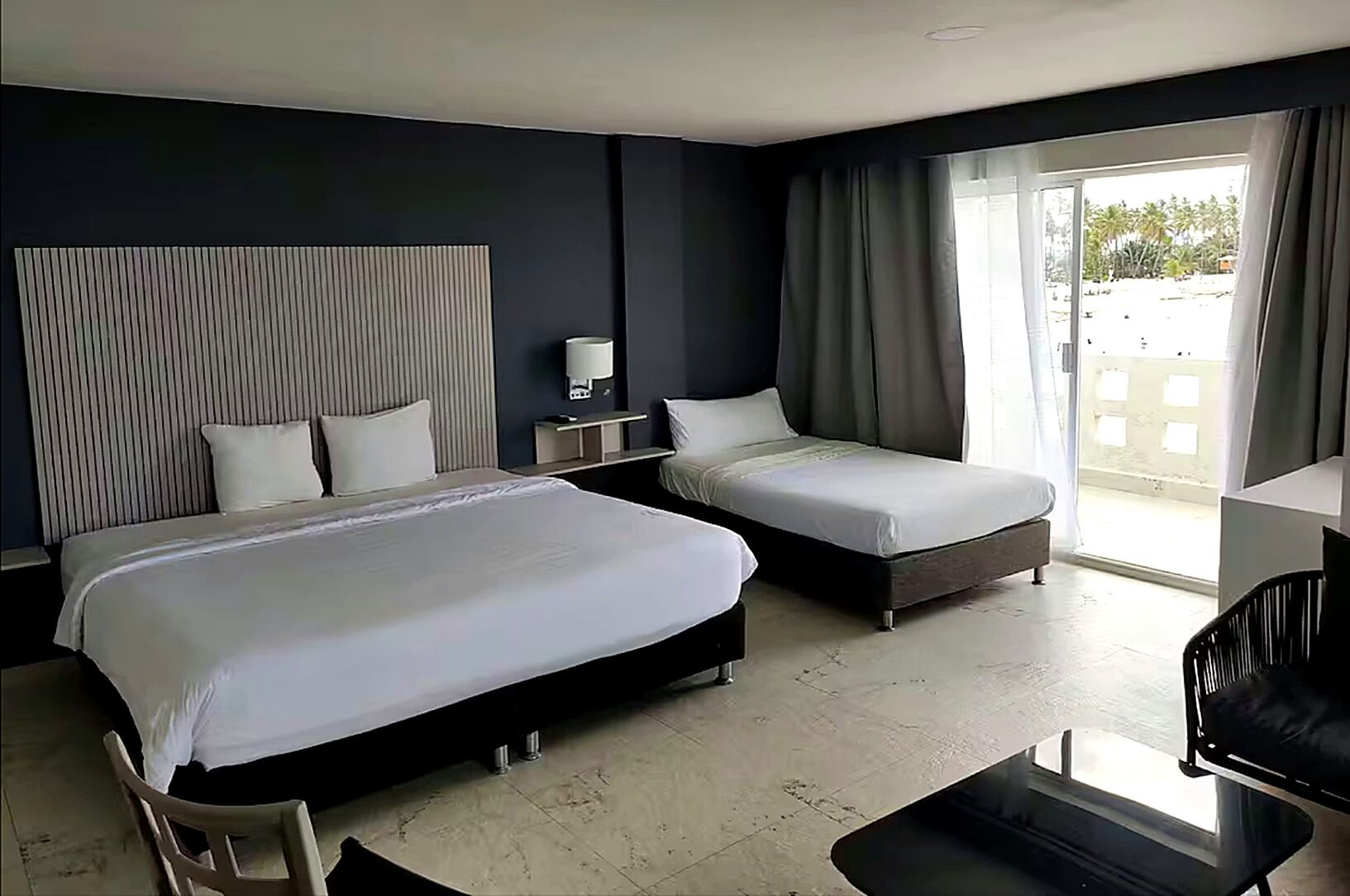 Deluxe Room, Multiple Beds, Housekeeping, Partial Sea View