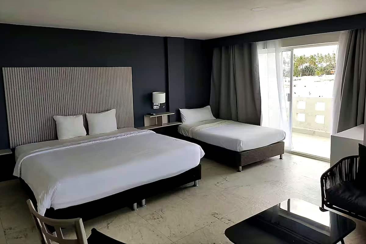 Deluxe Room, Multiple Beds, Housekeeping, Partial Sea View