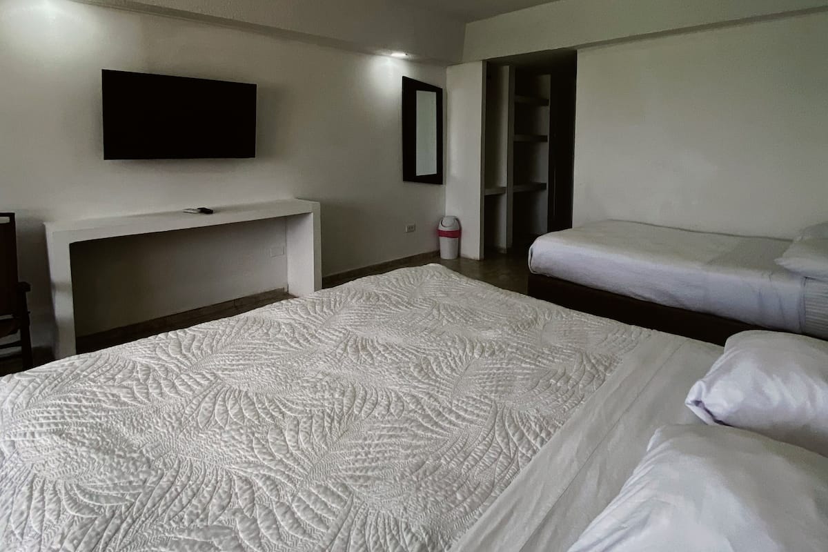 Standard Triple Room, Multiple Beds, Housekeeping, Partial Ocean View | Minibar, in-room safe, desk, soundproofing