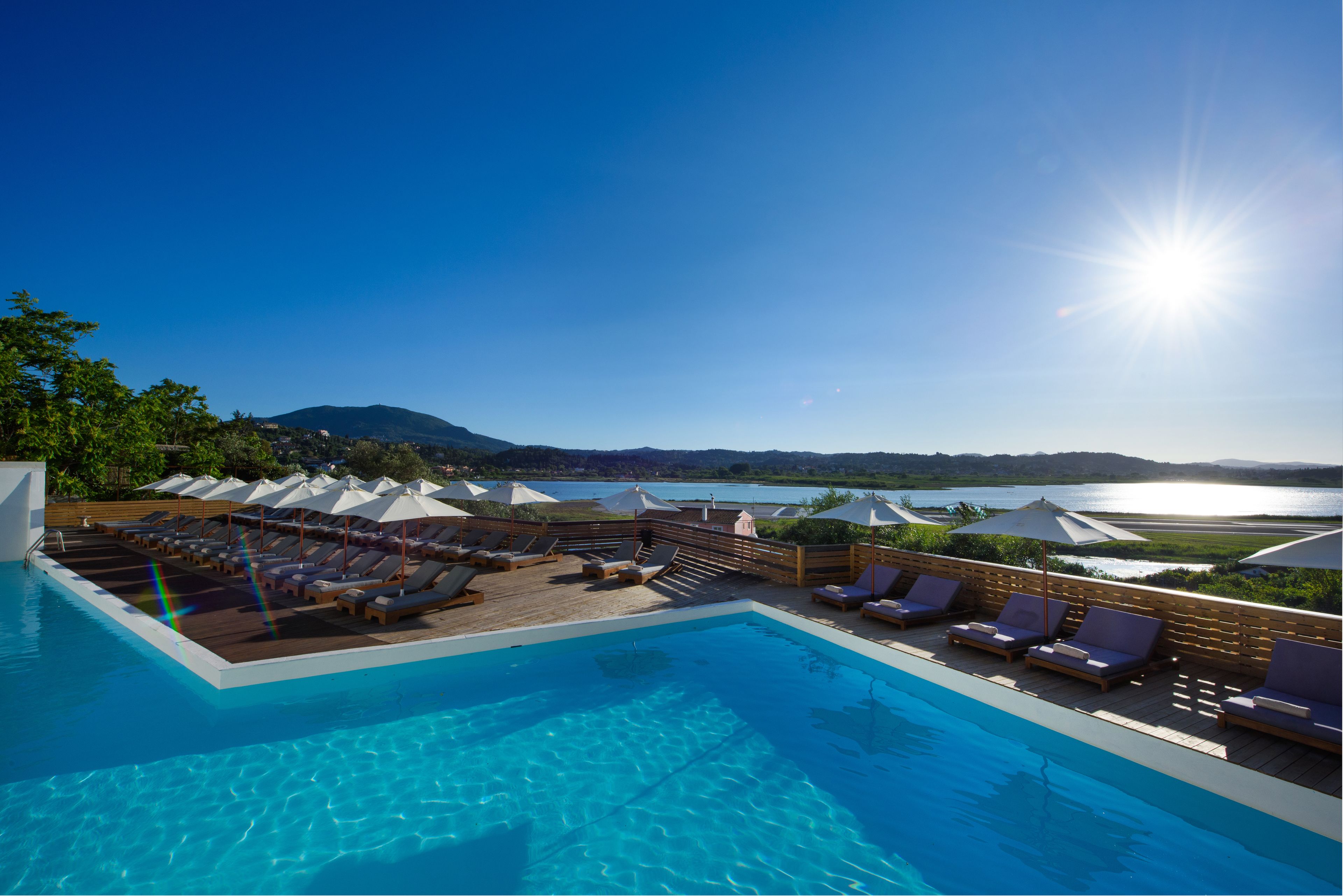 outdoor pool, pool umbrellas, pool loungers