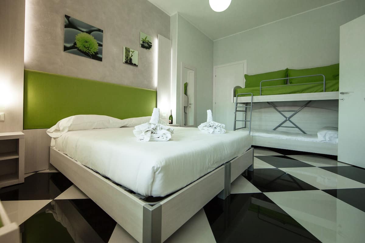 Family Room | Hypo-allergenic bedding, minibar, in-room safe, desk