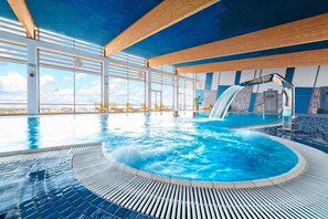 Indoor pool, open 8:00 AM to 11:00 PM, pool loungers