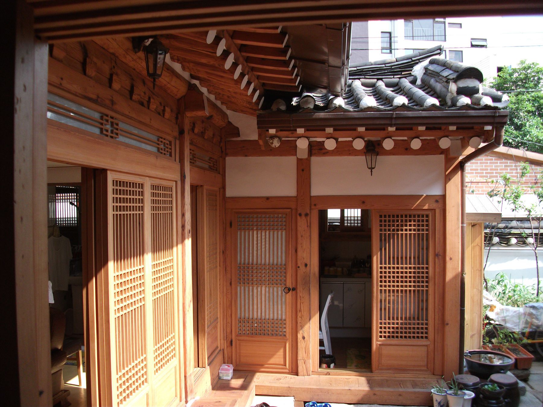 A traditional Japanese wooden structure with sliding doors and a tiled roof.